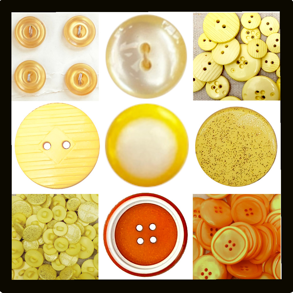 Assorted vintage buttons in yellow and orange colors arranged on a wooden surface
