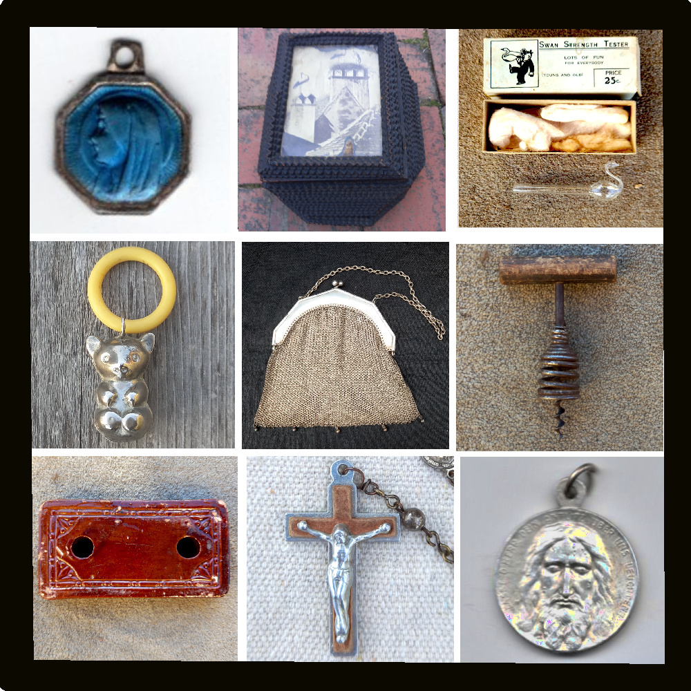 Collection of small antique items including vintage trinkets, miniature decor pieces, and aged collectibles displayed on a wooden surface