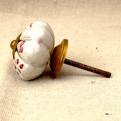 White hand painted ceramic cabinet knob with decorative design