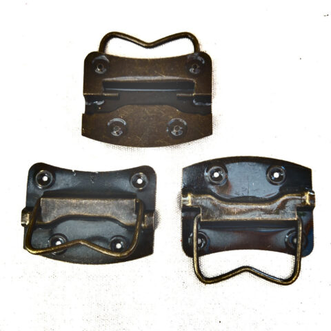 Ferrous metal chest handle with curved grip and aged industrial finish