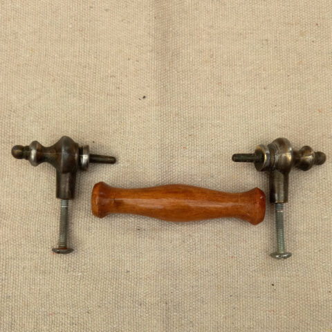 Vintage cabinet handle with wooden grip and metal ends, 95mm centre to centre hole spacing