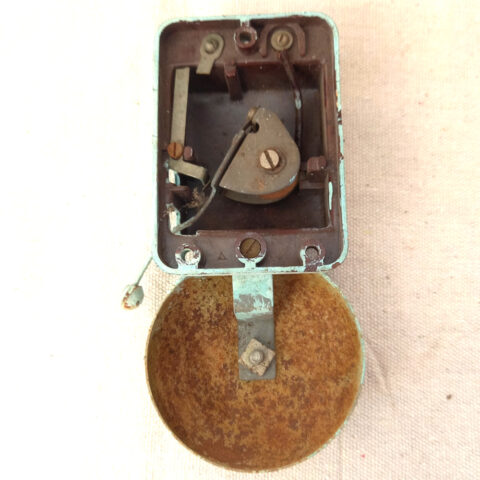 Vintage painted Bakelite door bell with classic retro design mounted on wall