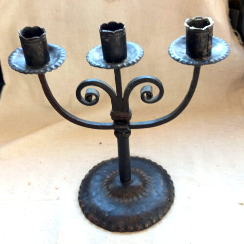 Vintage handmade wrought iron three candle holder with rustic design and three arms