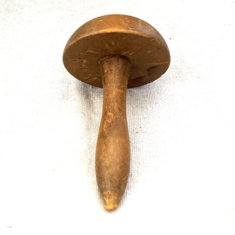 Vintage wooden darning mushroom sewing tool used for mending socks and knit fabric