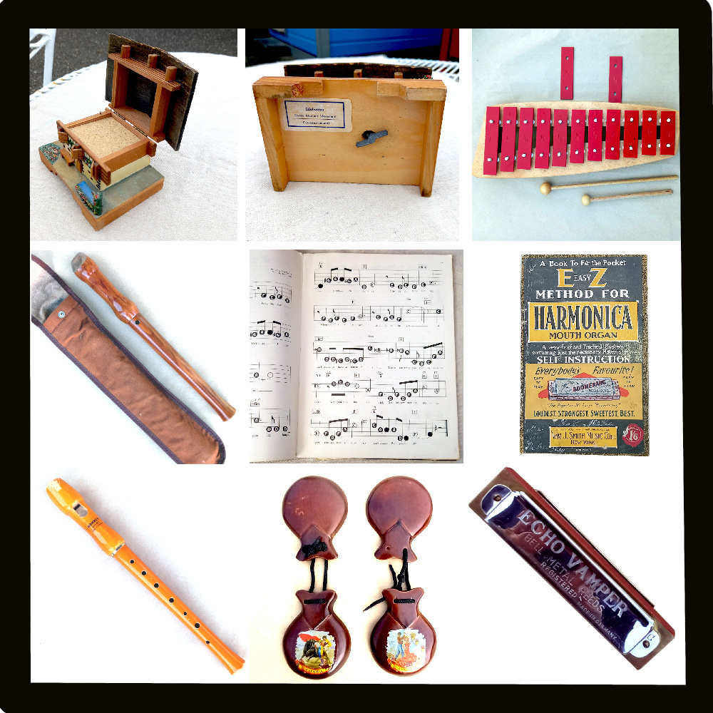 A selection of musical items, including wooden recorders, xylophones, musical notebooks, music boxes, castanets, and harmonicas.