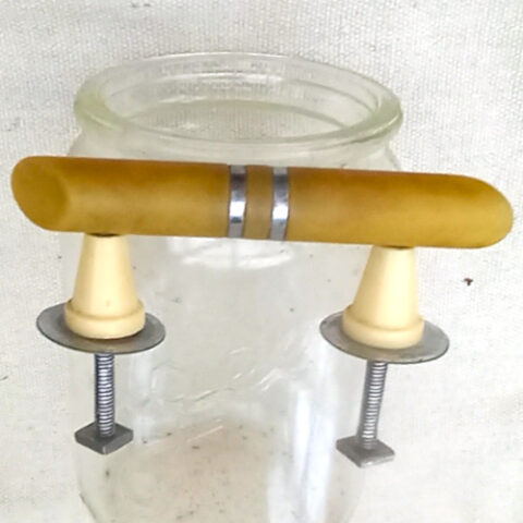 Art Deco pull handle with honey-colour Bakelite and chrome finish, 50mm centre to centre, suitable for drawers and cabinets