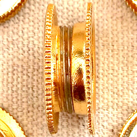 20mm round brass flush pull recessed into a sliding glass panel with a smooth polished finish