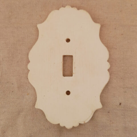 mid-century decorative toggle switch cover plate with ornate design and 58mm screw spacing