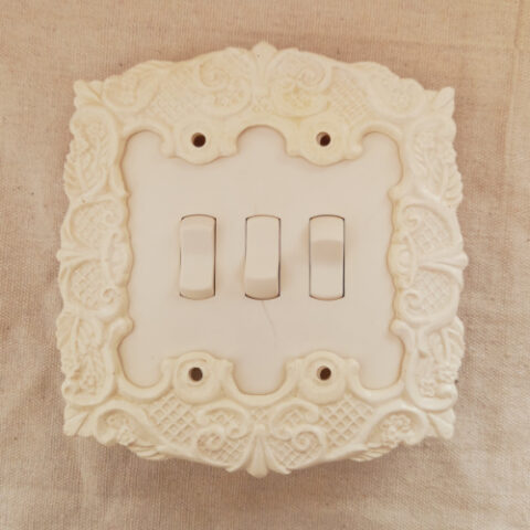 vintage decorative toggle switch cover plate with ornate mid-century design and 83mm screw spacing