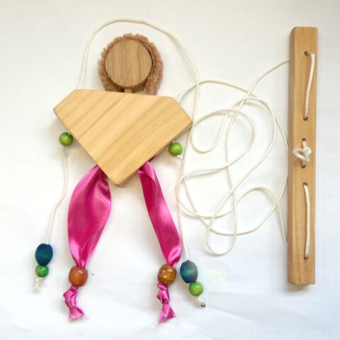 Child playing on New Zealand made CLIMBSY wooden climbing toy by Willow Bank for indoor active play and motor skill development