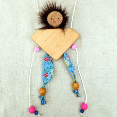 CLIMBSY wooden climbing toy handcrafted in New Zealand by Willow Bank, climbing up two strings step by step through gentle pulling motion.