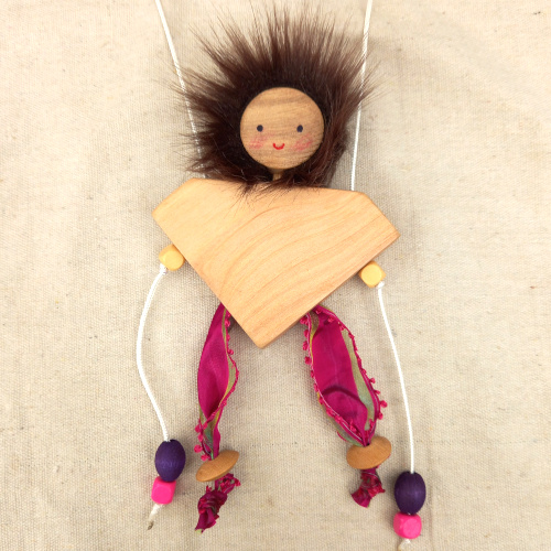CLIMBSY wooden climbing toy handcrafted in New Zealand by Willow Bank, climbing up two strings step by step through gentle pulling motion.