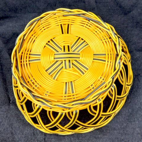 Retro yellow and black plastic wicker fruit basket for kitchen storage and display