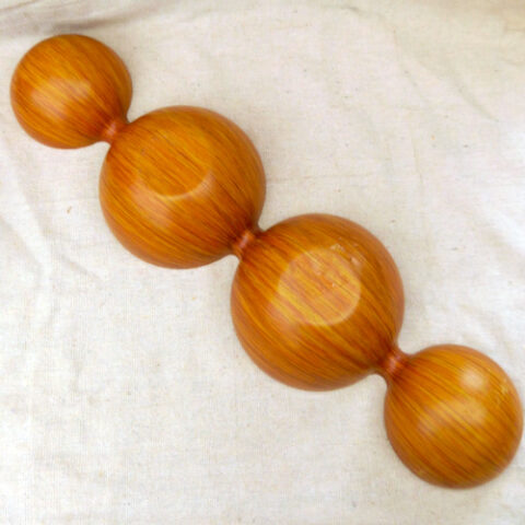 Vintage 70s melamine serving bowl with avocado green interior, faux wood exterior, and four divided compartments