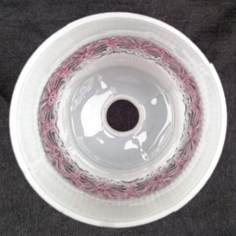 Retro cylindrical light shade with textured white and clear finish, ideal for modern lighting setups.