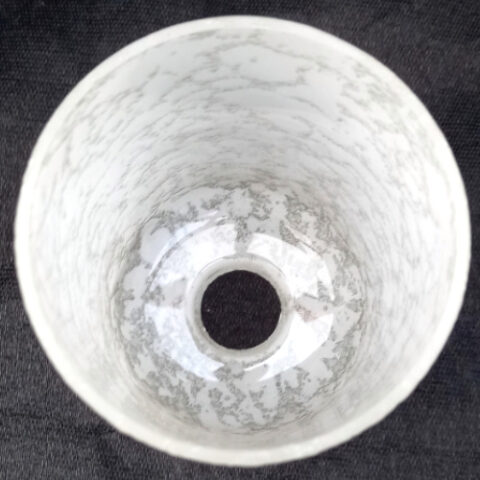 Retro cylindrical light shade with textured white finish, perfect for modern lighting solutions.