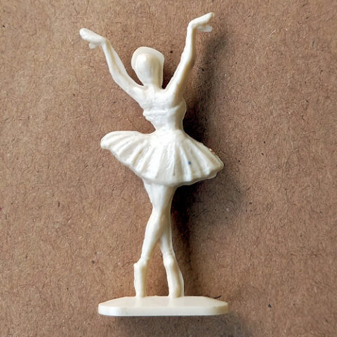 Vintage margarine figurine of a ballerina ballet dancer in a graceful pose