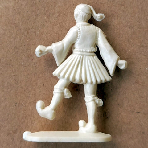 Vintage 1950s margarine figurine of Greek man dancing in traditional style with molded detail