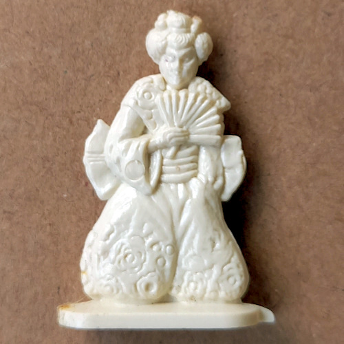 Vintage 1950s Japanese geisha margarine figurine with traditional kimono and retro molded detail