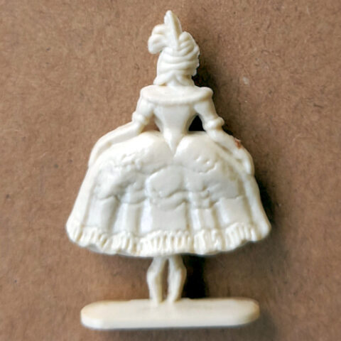 Vintage margarine figurine of a court ballet dancer in elegant pose close-up
