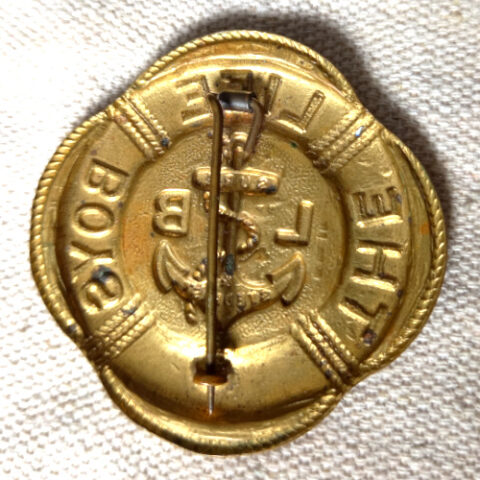 Vintage The Life Boys brass badge with blue enamel centre and classic emblem design