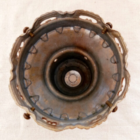 Vintage ornate metal lamp shade holder with intricate scrollwork and antique finish