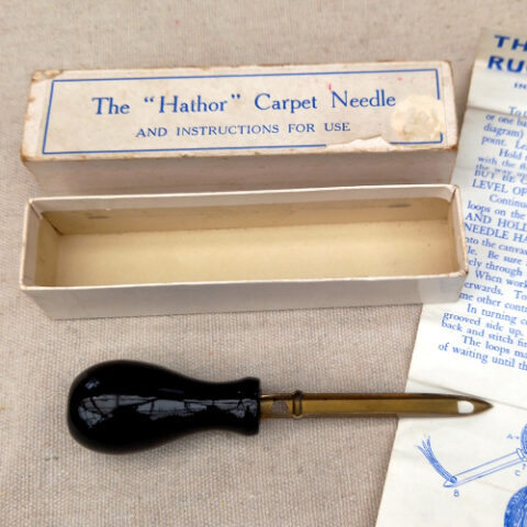 Rare vintage HATHOR Carpet Needle, collectible rug-making and sewing tool with classic haberdashery design.