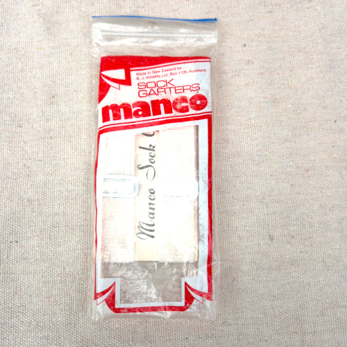 Pair of vintage Manco sock garters with retro elastic straps and metal fasteners