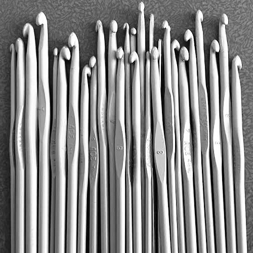 Collection of vintage aluminium crochet hooks in assorted sizes for crochet and lace making.