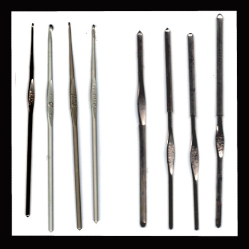 Single vintage metal crochet hook for crocheting and crafting.
