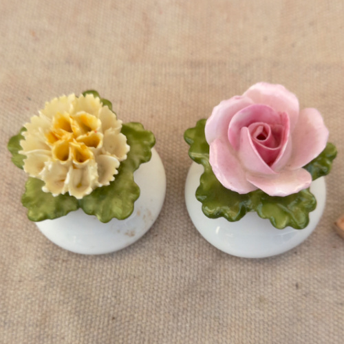 Vintage Denton China salt and pepper shakers with floral design, pink rose for salt and yellow carnation for pepper, made in England, salt stopper missing.
