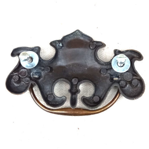Vintage decorative brass swing pull handle with 65mm centre-to-centre mounting for cabinets and drawers