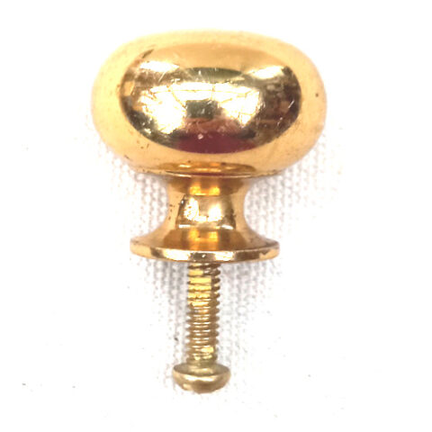 Heavy-duty brass-coated classic round drawer knob fitted to a wooden cabinet drawer.