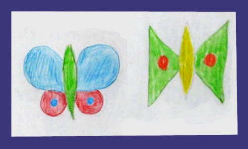 Child's 3D butterfly picture made with colourful paper butterflies attached to a drawing.