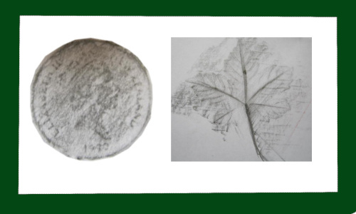 Children creating pencil rubbings of leaves and coins on paper.