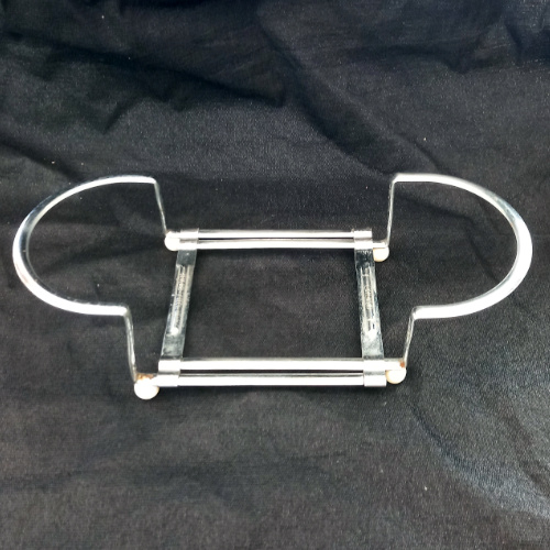 Vintage Swiss Extensio extendable metal hot pot carrier and trivet holder with patent O.H.Z. Brevete marking, mid-century kitchen accessory.
