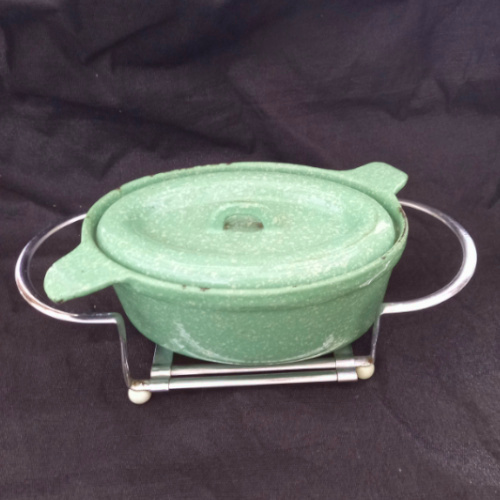 Vintage Swiss Extensio extendable metal hot pot carrier and trivet holder with patent O.H.Z. Brevete marking, mid-century kitchen accessory.