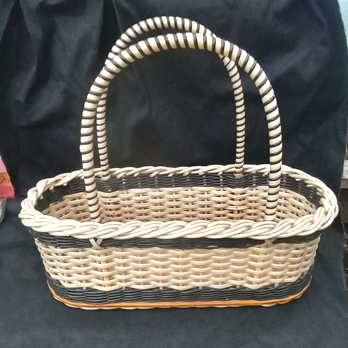 1960s vintage plastic woven shopping basket with sturdy handles and retro design