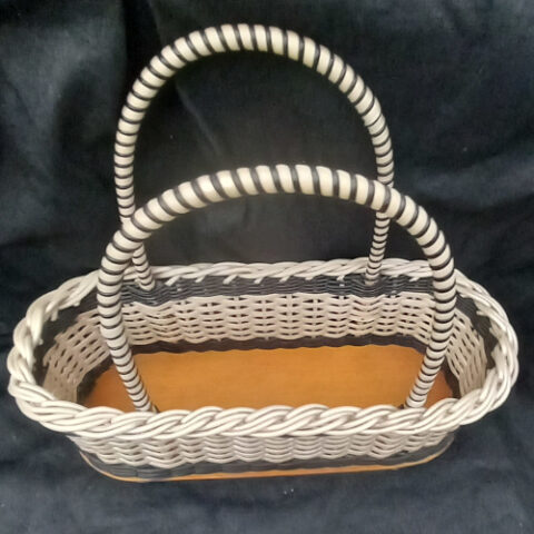 1960s vintage plastic woven shopping basket with sturdy handles and retro design