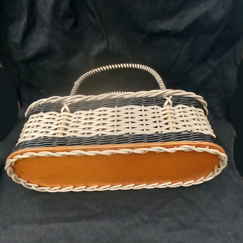 1960s vintage plastic woven shopping basket with sturdy handles and retro design