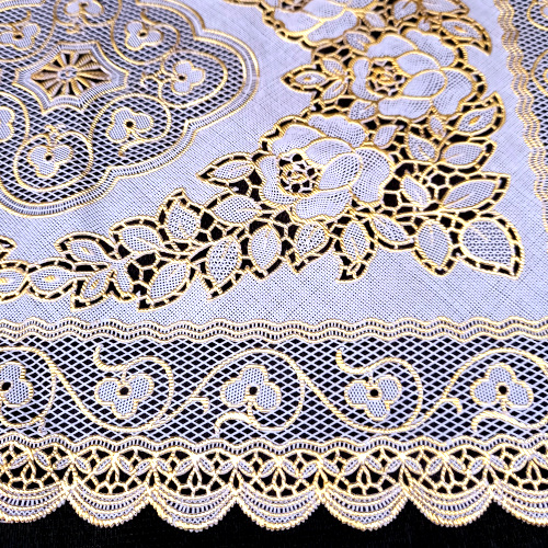 Vintage cream and gold plastic doily measuring 300 x 450mm with decorative lace pattern
