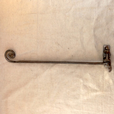 Antique fanlight stay with decorative scroll end in ferrous metal for period fanlight windows