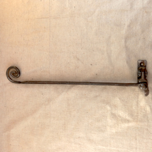 Antique fanlight stay with decorative scroll end in ferrous metal for period fanlight windows