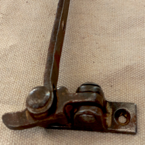 Antique fanlight stay with decorative scroll end in ferrous metal for period fanlight windows