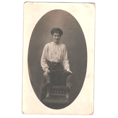 Vintage real photo postcard of a woman photographed by Alva Studio in Wellington.