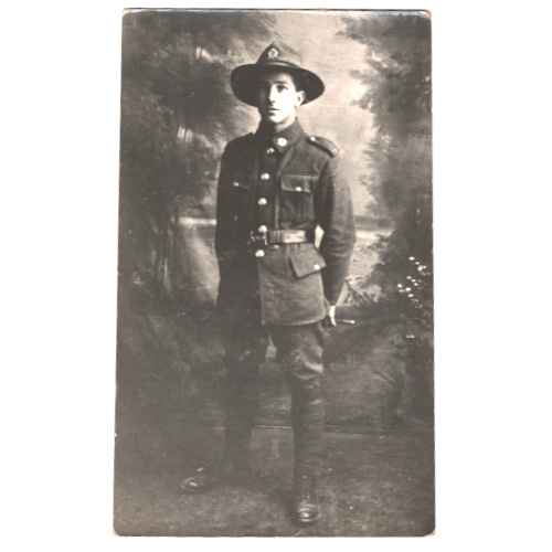 Vintage real photo postcard of a young soldier in military uniform by Frank Duncan & Co, Auckland.