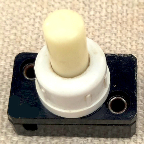 Vintage Bruma 2A 250VAC on-off push button lamp switch with glow in the dark button.