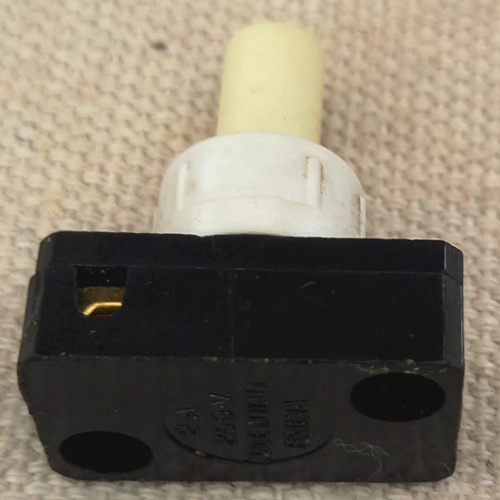 Vintage Bruma 2A 250VAC on-off push button lamp switch with glow in the dark button.