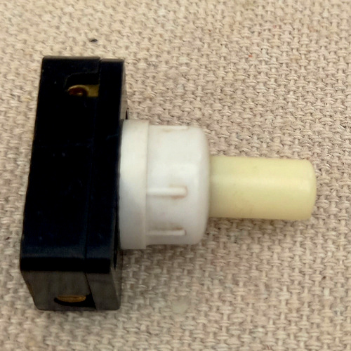 Vintage Bruma 2A 250VAC on-off push button lamp switch with glow in the dark button.