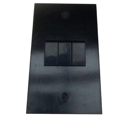 Vintage black PDL triple light switch model 283/I with three toggle switches.